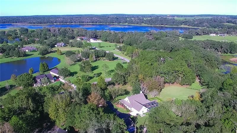 The home is seen center-right near the bottom of this photo. Hancock Lake is seen near the top of the photo. Deeded access to the Lake is provided through an Association owned area/lot on the Lake. Amenities include a picnic area and a grassy boat launch.