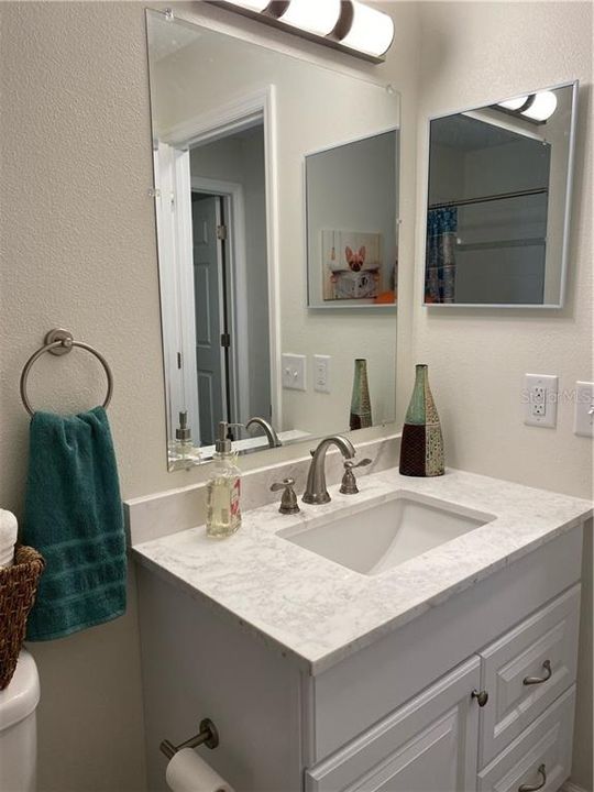 Again, all brushed nickel finished in this bathroom also, the light colors are very neutral. Gorgeous!