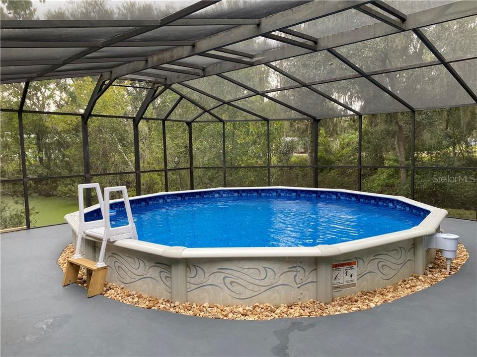 Great entertaining space. Pool is new this year, the cage has been newly screened.