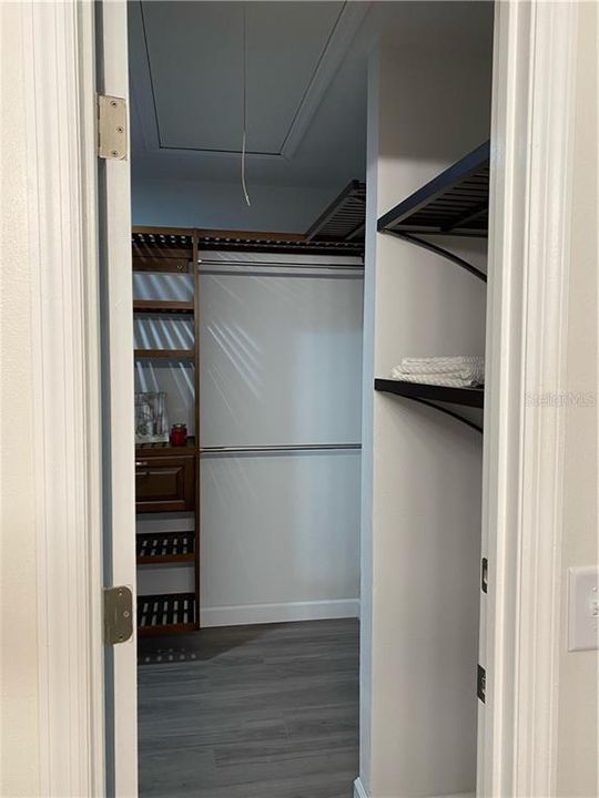 Entering the walk-in closet, where you will find ample space for all your clothes+