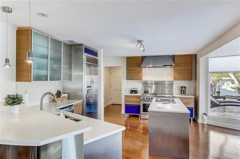 The well equipped kitchen features stainless steel appliances including a gas range.