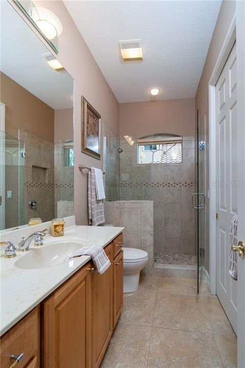 Tiled frameless walk-in shower.