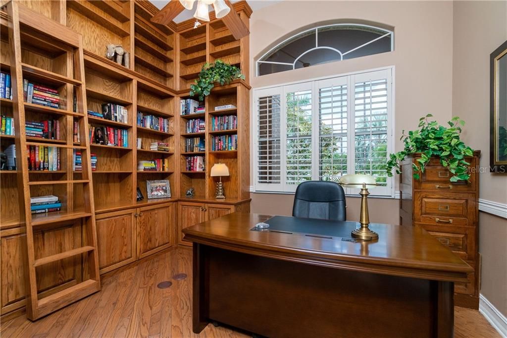 Floor-to-ceiling built in shelves and cabinetry provide an ideal home for your favorite novels.