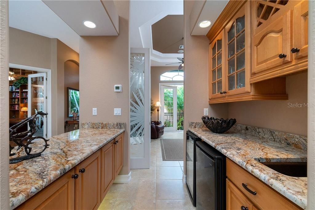 Entertaining is a breeze, with the large wet bar conveniently connected to the living room, dining room and kitchen.