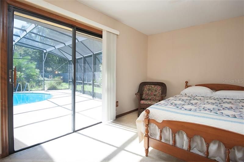 Bedroom 3 has a wonderful pool view and a new sliding door!