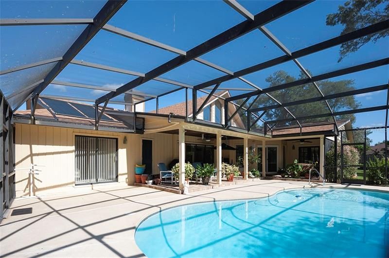 Heated pool with additional solar, pool sweep and large "L' shaped lanai!