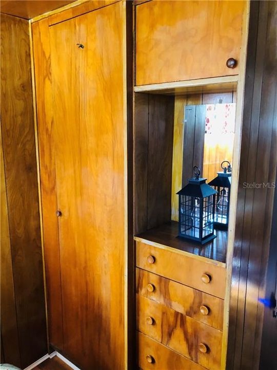 Built in dresser with additional closet or linen closet