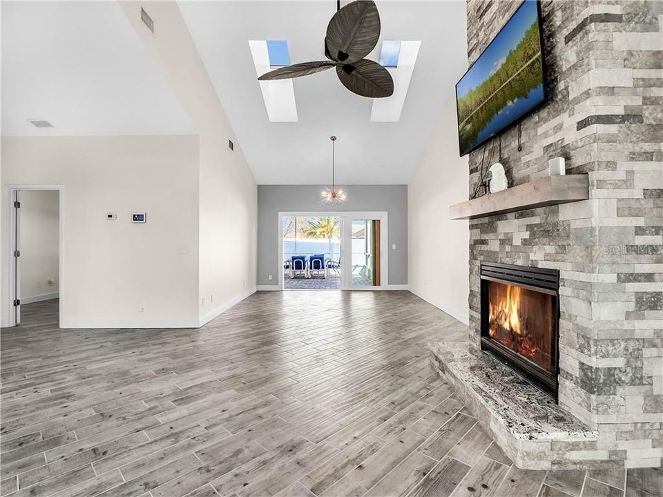 Pretty skylights & beautiful light fixture in the dining area.