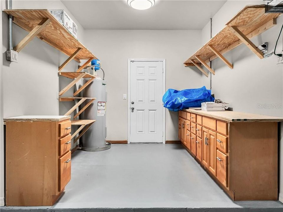 Extra work shop area in the garage. Brand new water heater. Access to the pool area from here.