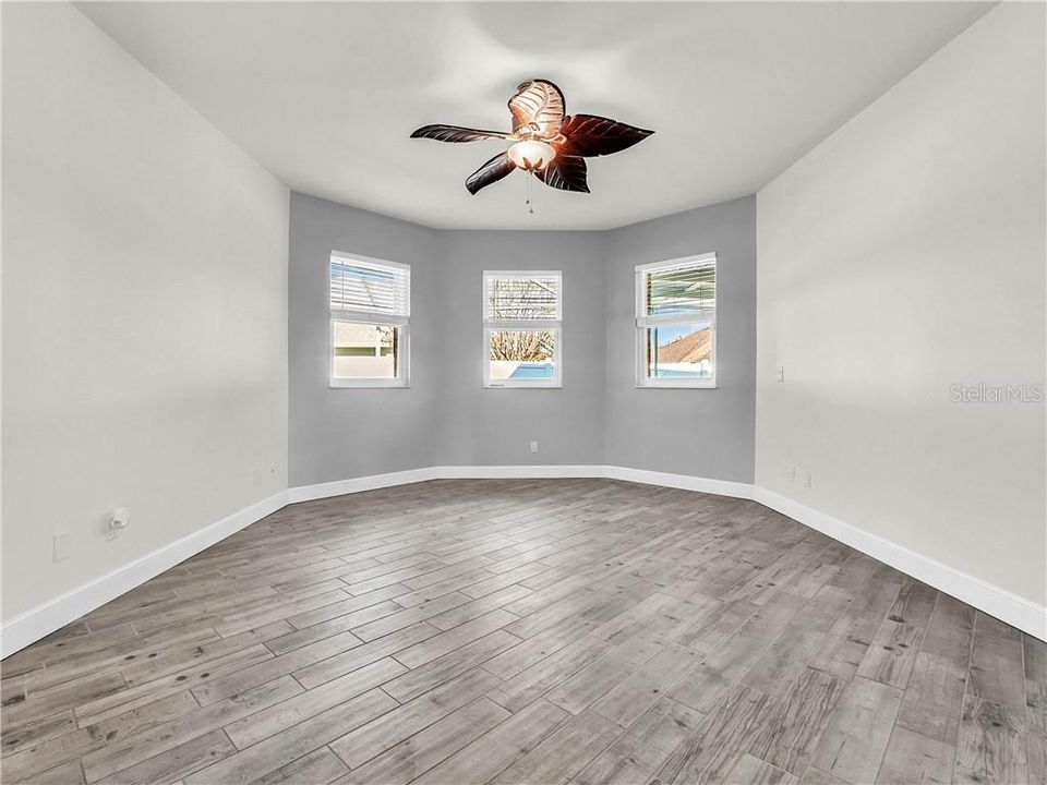 Master bedroom looks out to the pool area.