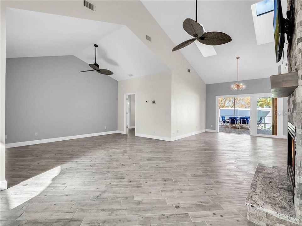 Living room & dining room looking out to lanai. Master bedroom entrance in the corner.  A true split plan.