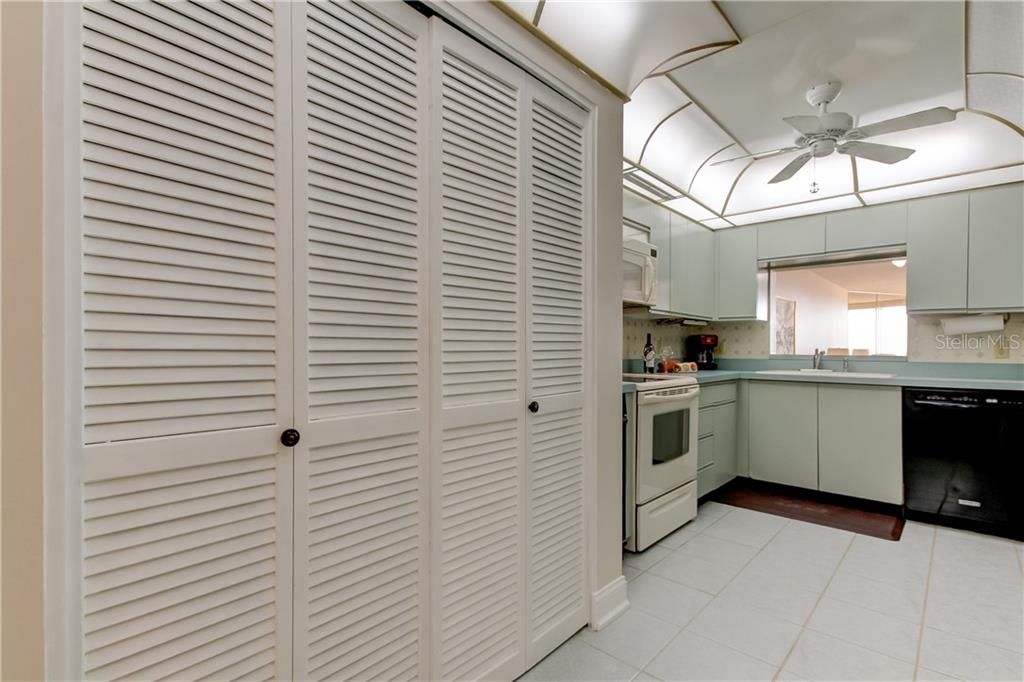 Washer and dryer behind the bi-fold doors