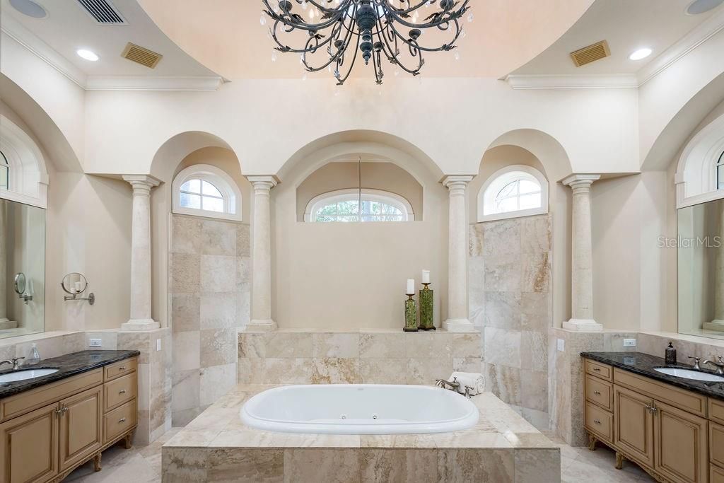 Master bathroom with duel vanities, jacuzzi tub and large pass through shower
