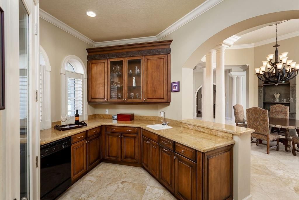Dining room wet bar/ serving area with a 480 bottle wine cellar