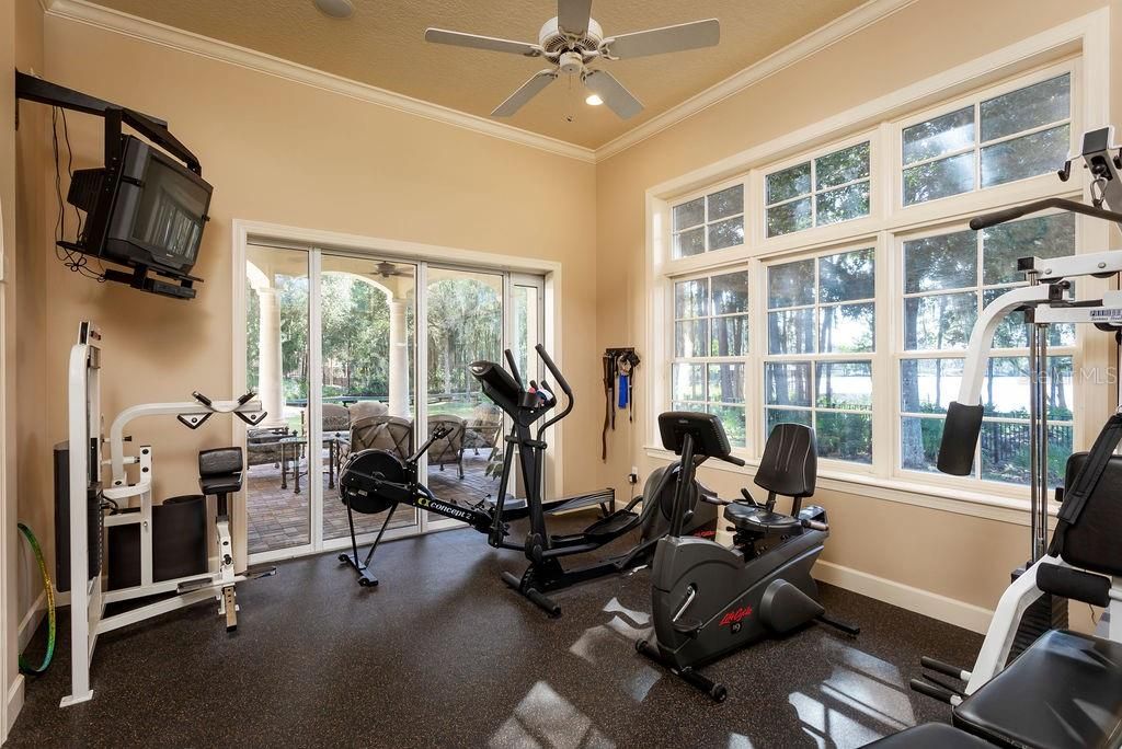 Home gym or 7th bedroom with a closet and full bathroom