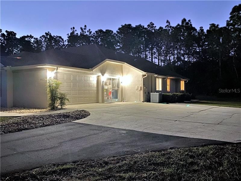 Driveway! Partially Screened 3 Car Garage!