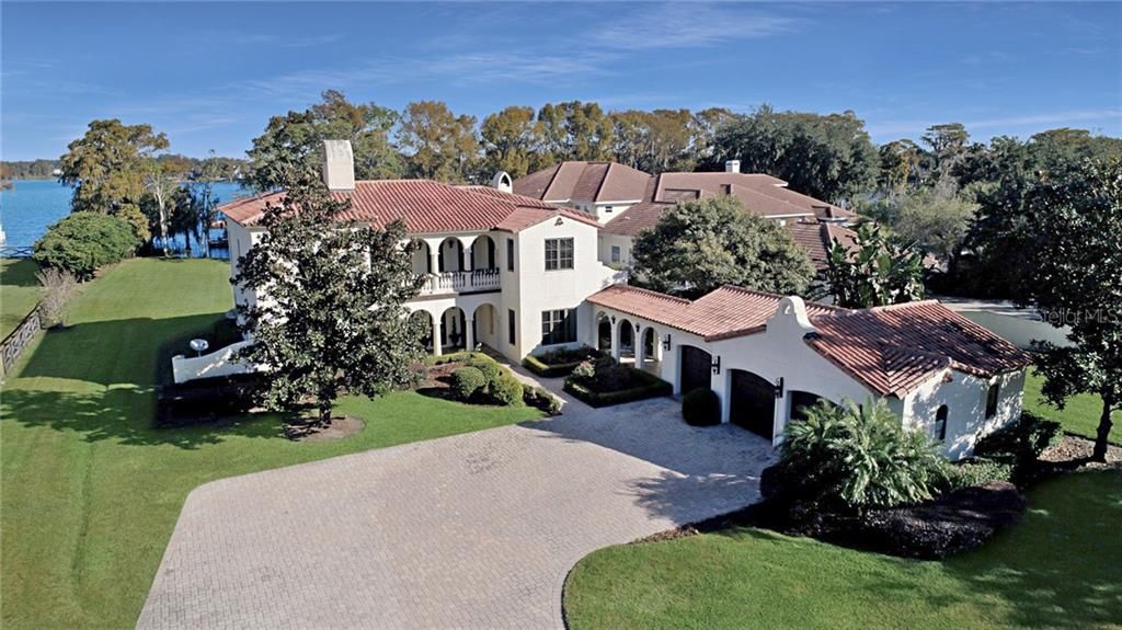 Pristinely manicured lakefront estate on two acres.