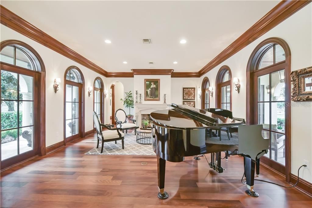 The beautiful wood trim and archways are reminiscent of a luxurious Tuscan villa, right in the heart of Central Florida.