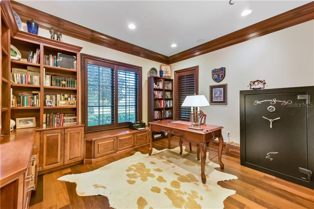 Work from home? No problem! This executive style office will ensure you are Zoom meeting ready with gorgeous built-ins, plantation shutters and a lovely window seat.