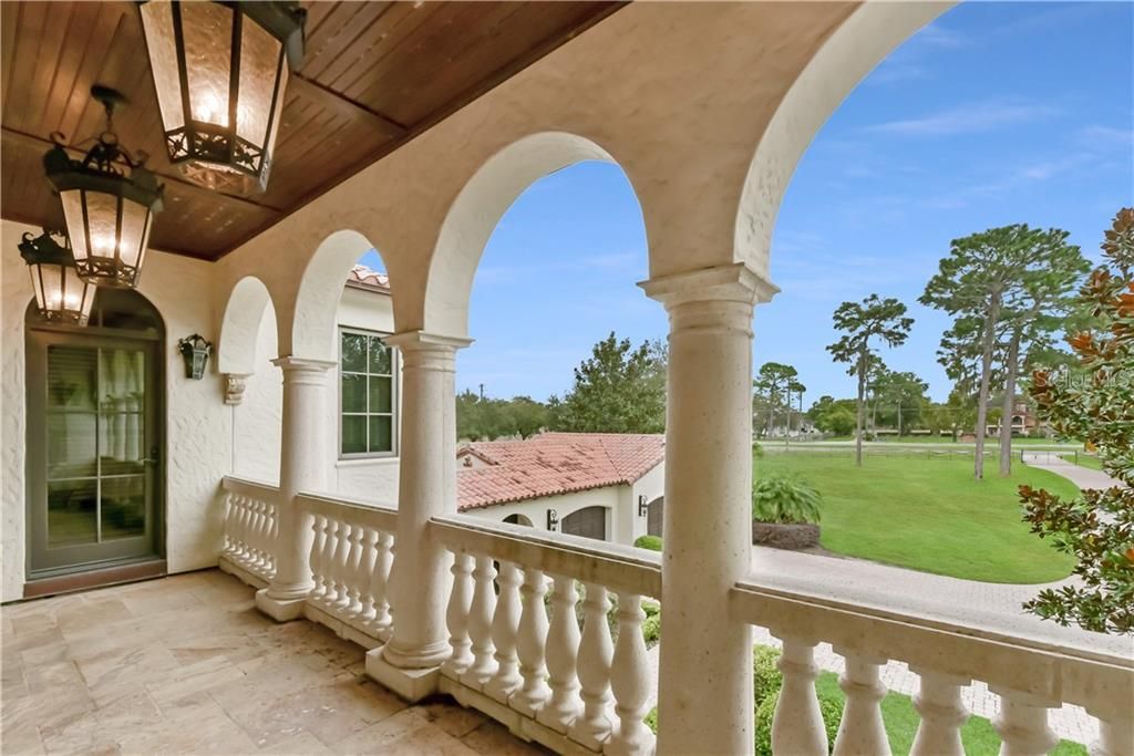 Second terrace overlooking front of property. Take note of the ceiling trim, arches on balcony and interior doors. And another beautiful view.