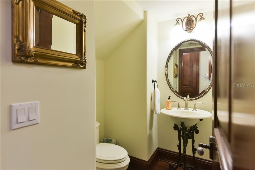 One of two half bathrooms, located downstairs. Perfect for guests.