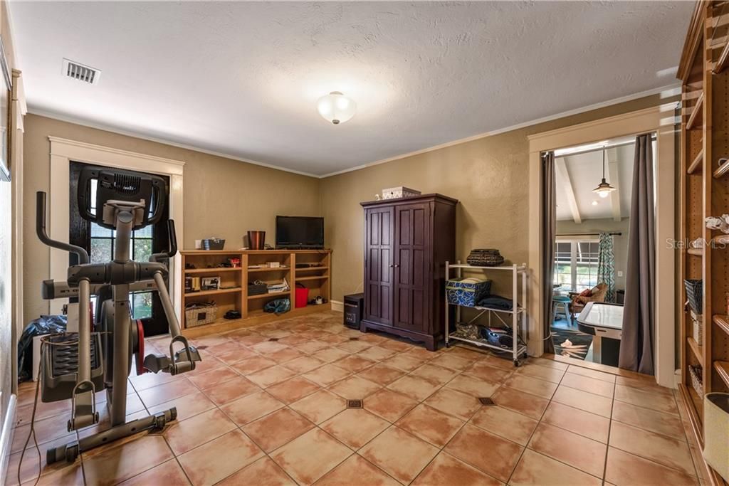 A wonderfully sized OFFICE/DEN is down the hall from the Living Room and can also be used as a HOME GYM or a BONUS 1st Floor BEDROOM with private access to the Patio!