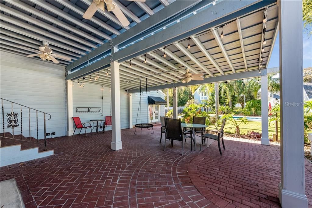Several French Door access points lead you outside to the OVERESIZED COVERED PATIO that is an amazing space to entertain friends and have year round barbecues!