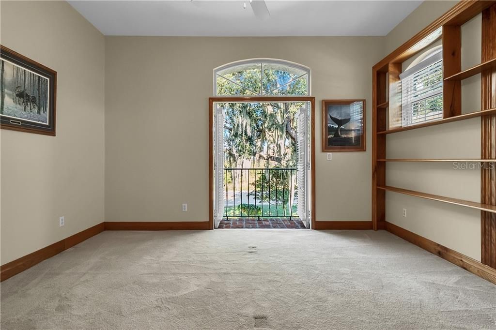 This bedroom has a balcony overlooking the conservation marsh.