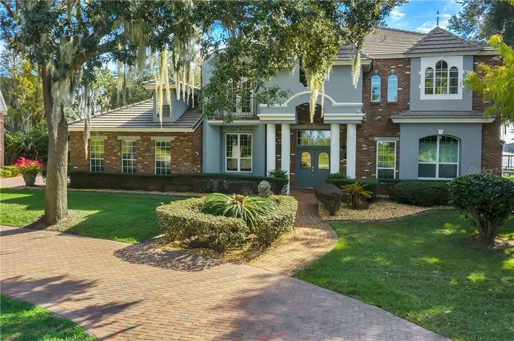 The circular driveway welcomes you to this amazing home.