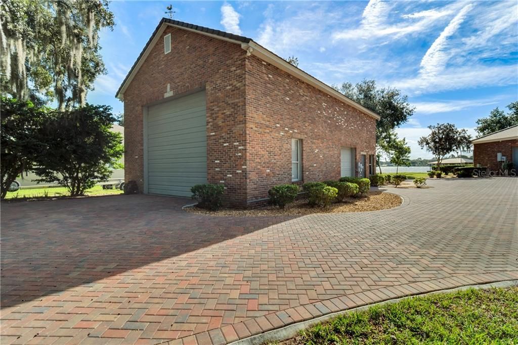 Two story free standing garage with a 2 garage door entrances. Fits 6 cars or a full RV bus.