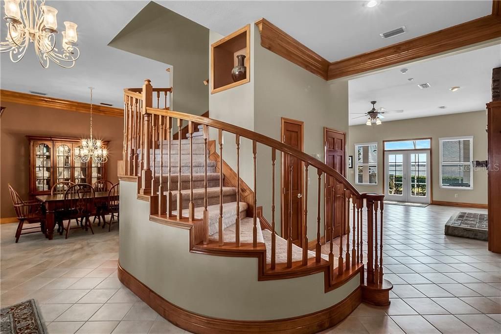 The stunning spiral staircase leads you to the second floor.