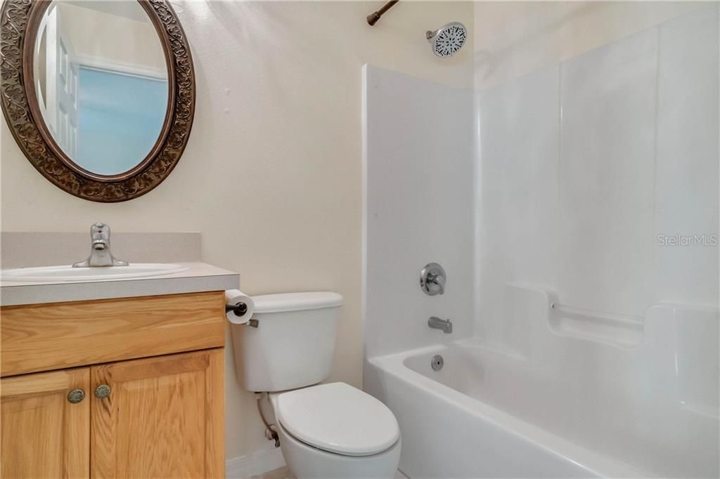 Second bathroom with shower tub and chic design choices