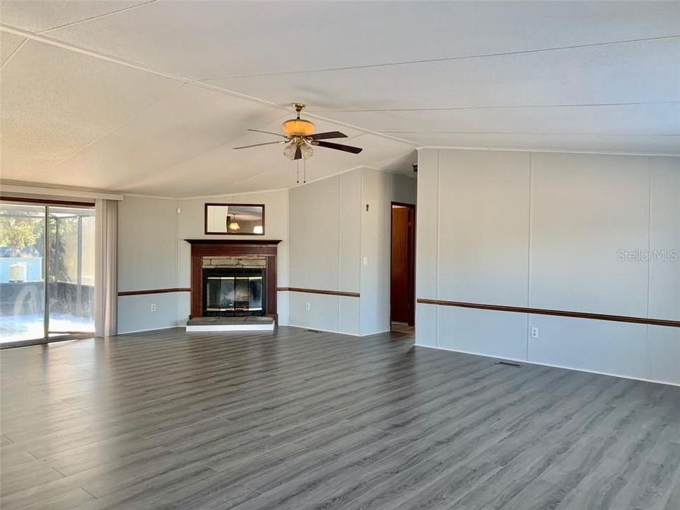 Living Room w/ Wood Burning Fireplace