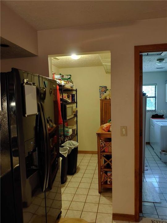 Pantry on one side and laundry room on the other side