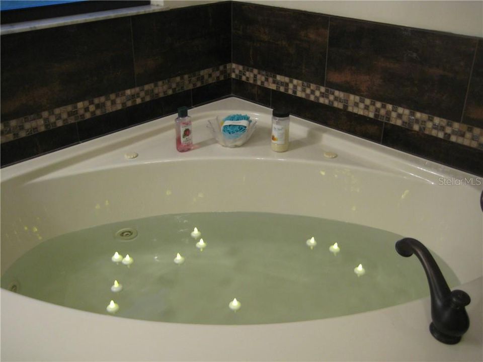 Beautiful tile work around the tub.