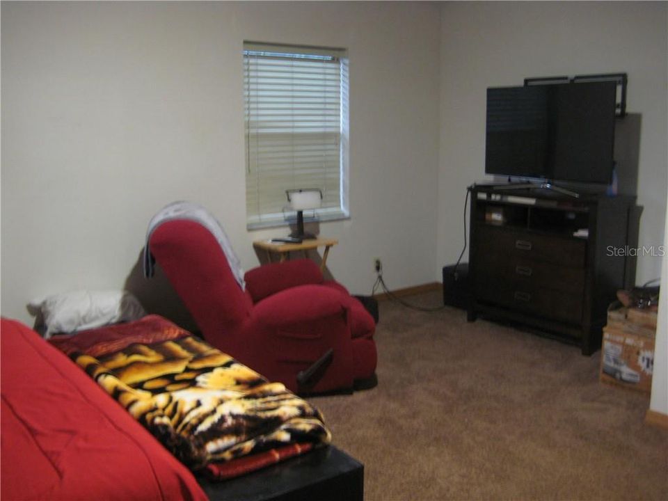 Master bedroom is large enough for a sitting area.