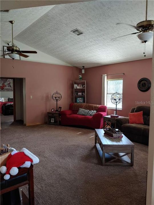Notice the high ceilings and two ceiling fans.