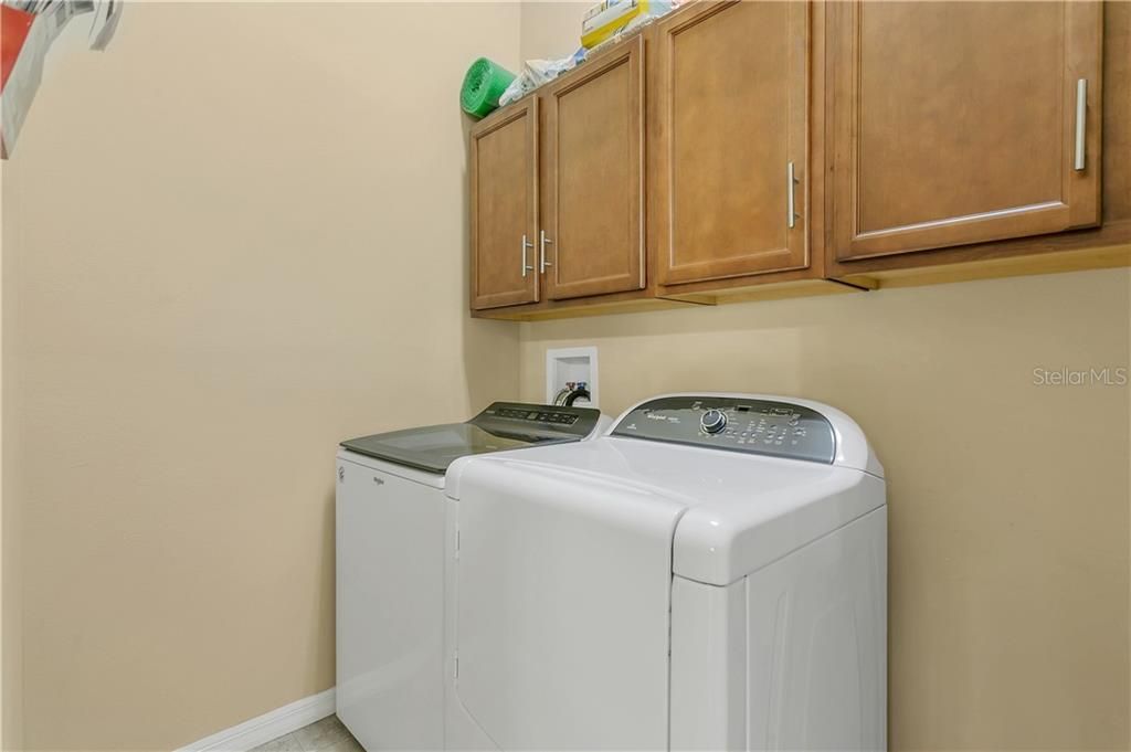 Indoor Laundry Room with storage cabinets. (Washer & Dryer do not convey).