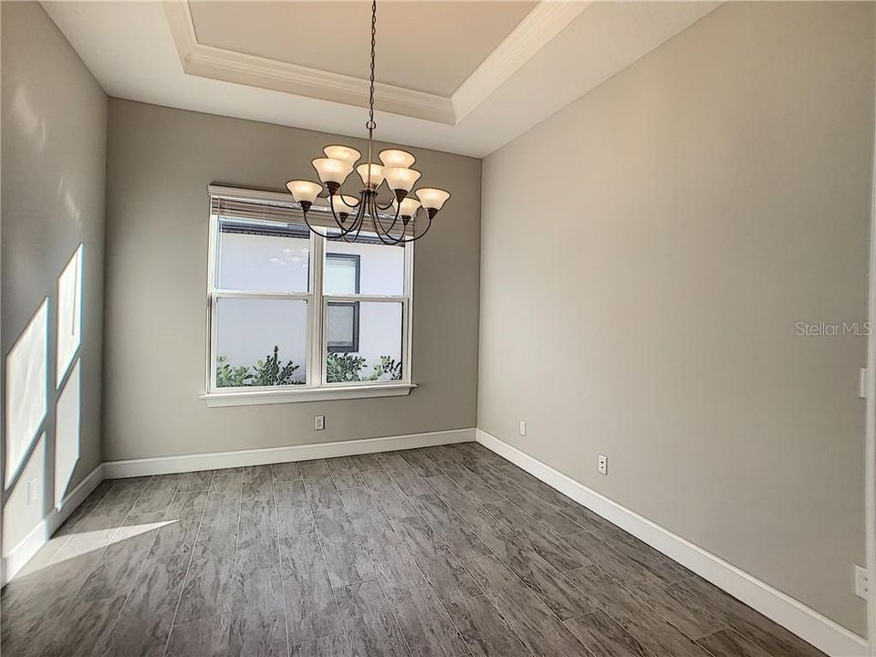 Den or dining room with pocket sliding doors