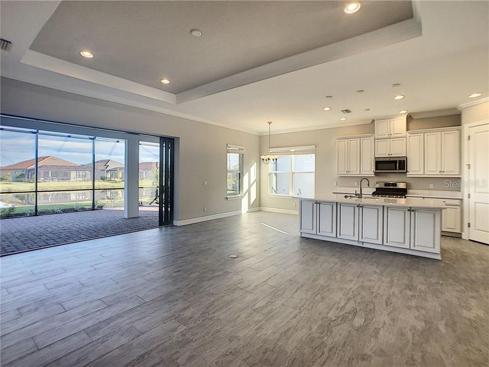 Island kitchen plank tile floors.