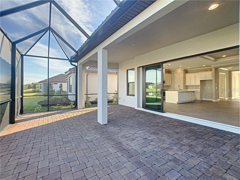 Extended lanai, pocketing sliding glass doors.