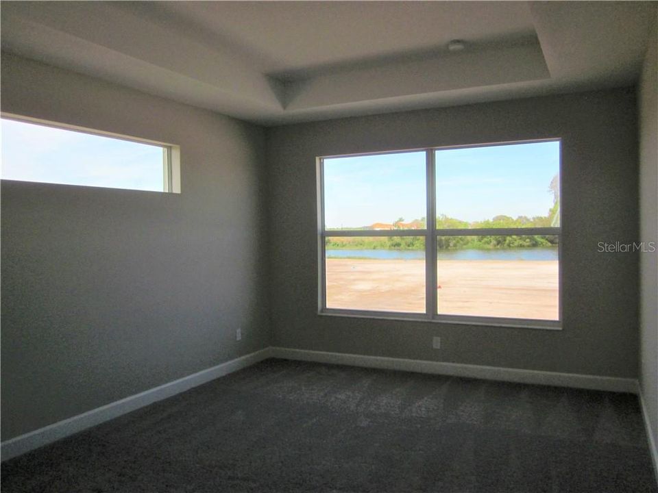 Master Bedroom with Trey Ceiling and Lake View!