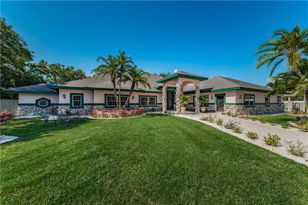WELCOME TO 5901 94TH AVE S. STUNNING ESTATE HOME WITH FANTASTIC PRIVATE PROPERTY FULLY ENCIRCLED BY 6' BLOCK WALLS TO ENSURE PRIVACY AND SECURITY.