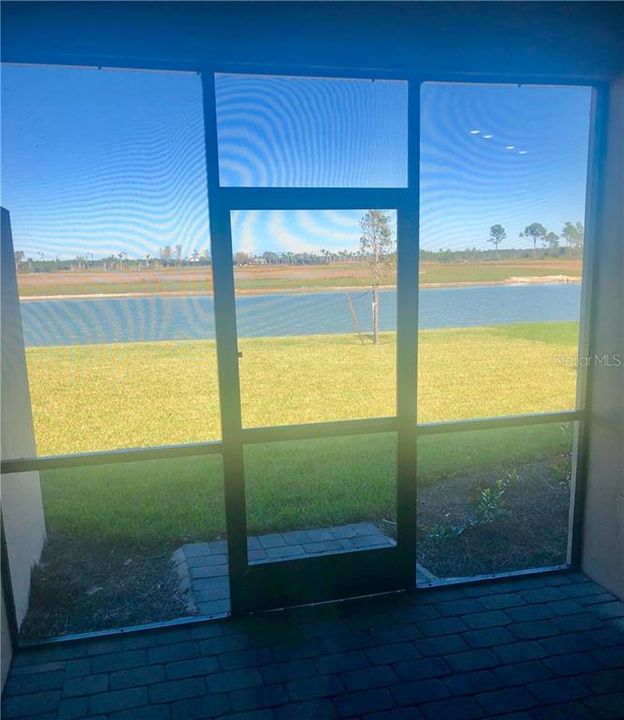 Screened lanai with water feature.