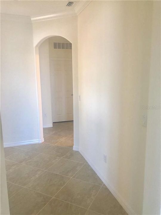 Entry to 2nd bedroom, laundry, and garage.