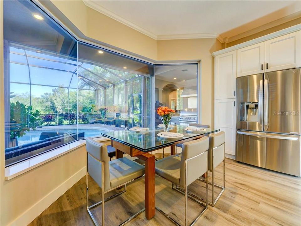 Dining space with wonderful views of patio, pool and lake