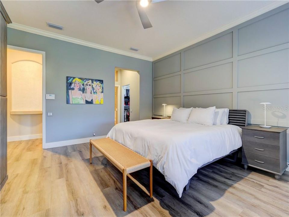 Master bedroom, relaxing grey tones, engineered wood flooring, custom built in and accent detailed wall