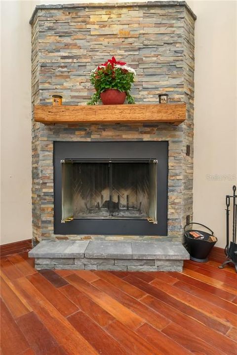 Wood burning fireplace perfect for this time of year!  Lovely wood mantle.