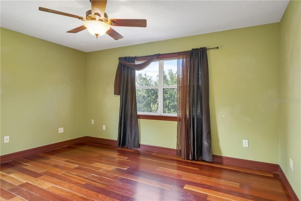 4th Bedroom overlooking the paddocks.  More of that beautiful wood!