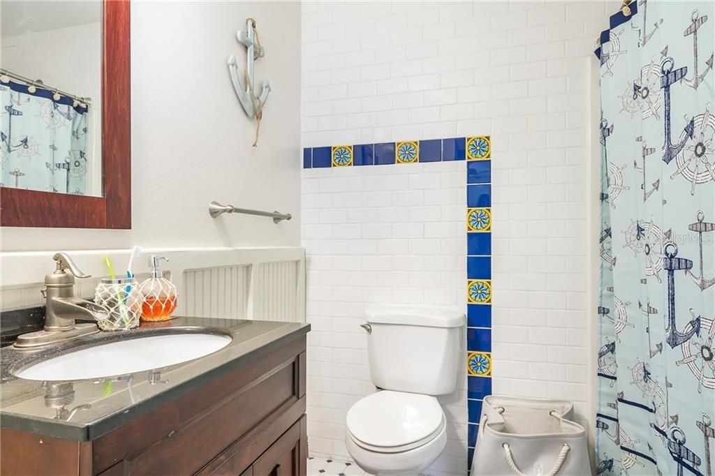 Bedroom 2 ensuite with subway tile and beautiful shower.